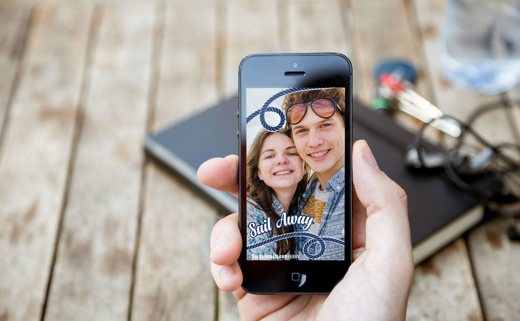 Couple with Snapcat geofilter on smartphone